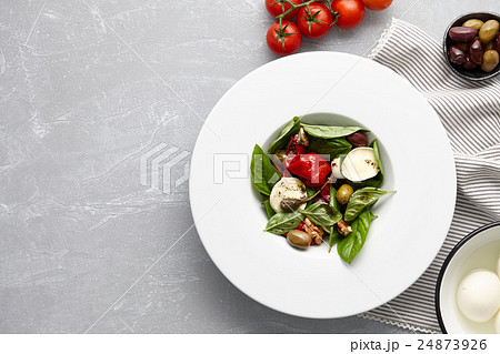Italian salad with basil, olives and mozzarella Italian salad with basil, olives and mozzarella 24873926
