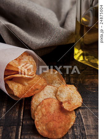 Bowl with potato crisps chips and olive oil  24875004