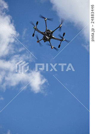 Copter flight against  blue sky. RC aerial drone. 24883446