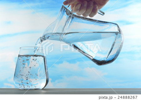 Fresh and clean drinking water in jug and glass  24888267