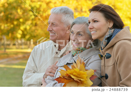 Daughter with senior parents in park Daughter with senior parents in park 24888739