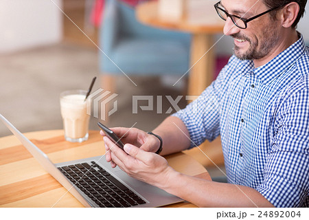 Handsome man using wearable technologies Handsome man using wearable technologies 24892004