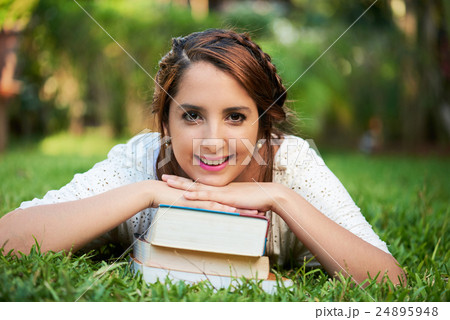 girl smiling on books 24895948