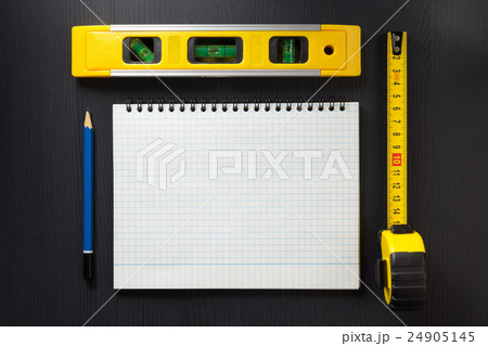 notebook and pencil on wood 24905145