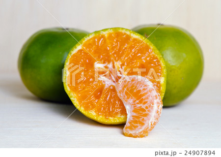 Orange fruit with half view isolated on wood Orange fruit with half view isolated on wood 24907894