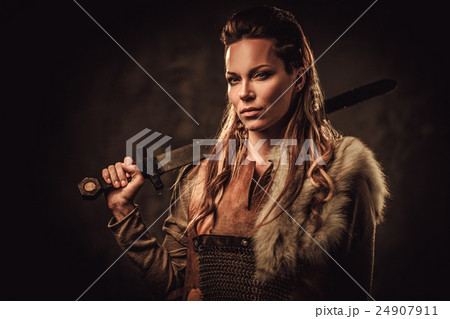 Viking woman with sword in a traditional warrior 24907911