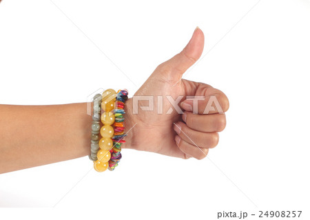left hand woman showing thumbs up and bracelet left hand woman showing thumbs up and bracelet 24908257