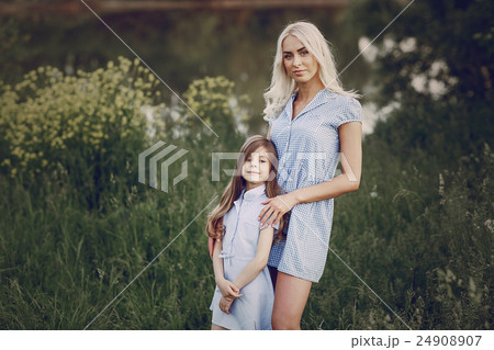 mom and daughter outside mom and daughter outside 24908907