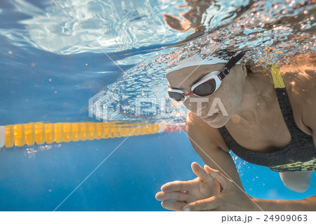 Close-up photo of underwater swimmer Close-up photo of underwater swimmer 24909063