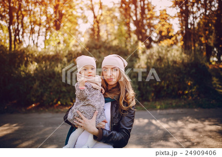 young family walking in the park 24909406