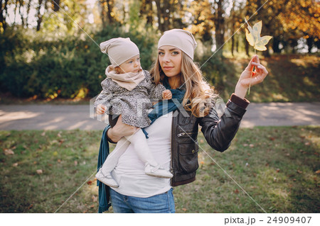 young family walking in the park 24909407