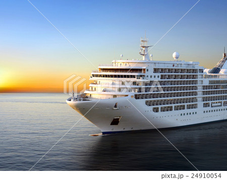 Luxury cruise ship sailing from port on sunset  24910054