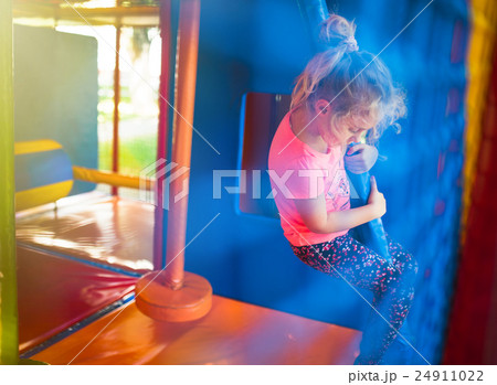 Cute little girl have fun at soft outdoor Cute little girl have fun at soft outdoor 24911022