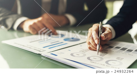 Business Colleague Discussing Paperwork Graphs Concept 24932264