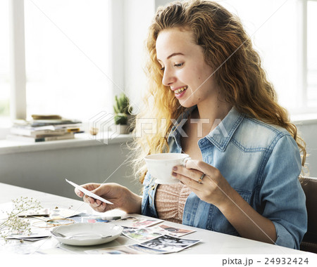 Girl Smiling Reminiscing Photos Concept Girl Smiling Reminiscing Photos Concept 24932424