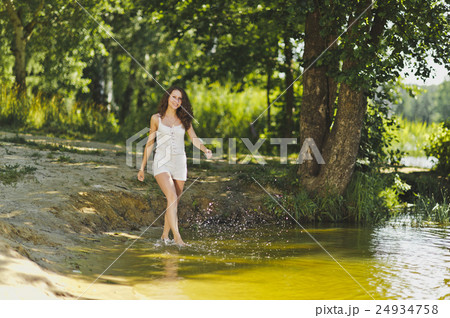 Portrait of a girl walking on the water the lake Portrait of a girl walking on the water the lake 24934758