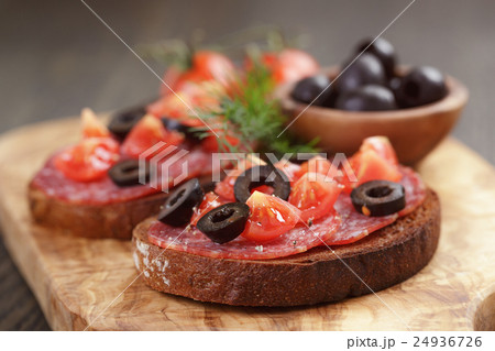open rye sandwich with salami and vegetables 24936726