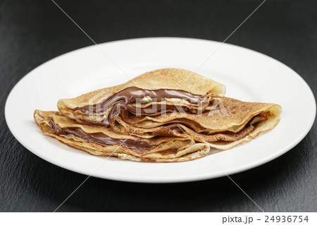 thin crepes or blinis with chocolate cream 24936754