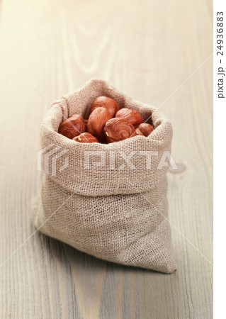 sack bag full of hazelnut kernels, rustic style sack bag full of hazelnut kernels, rustic style 24936883