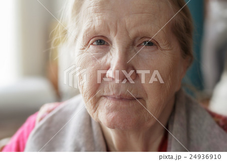 portrait of senior woman siting near the window 24936910