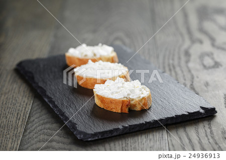 crunchy baguette slices with cream cheese on crunchy baguette slices with cream cheese on 24936913