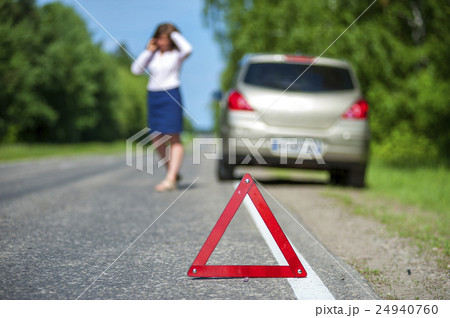 Red triangle sign and broken car on the roadside Red triangle sign and broken car on the roadside 24940760