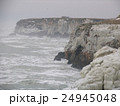 Sea coast in winter with clouds and waves 24945048