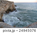 Sea coast in winter with clouds and waves 24945076