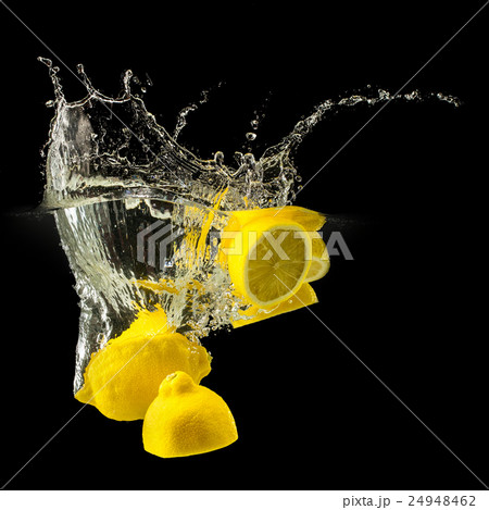 Group of fresh fruits falling in water on black Group of fresh fruits falling in water on black 24948462