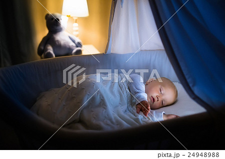 Baby boy sleeping at night 24948988