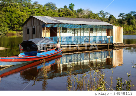 Houses on stilts rise above the polluted  24949115