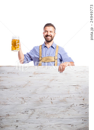 Handsome hipster man holding bear, copy space 24949773