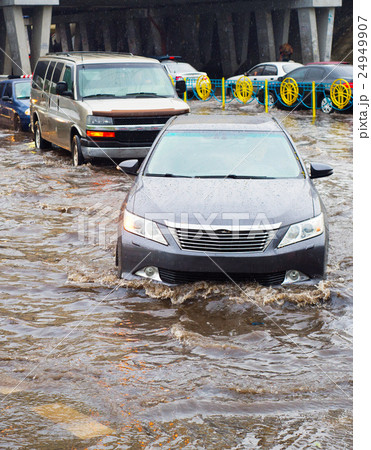 Cars on flooded road Cars on flooded road 24949907