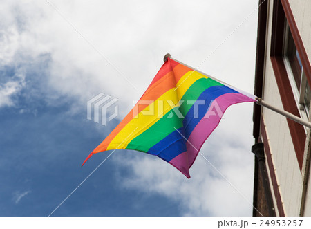 close up of rainbow gay pride flag waving outdoors 24953257
