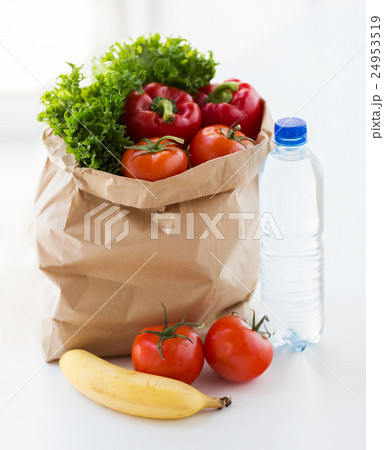 close up of bag with friuts, vegetables and water 24953519