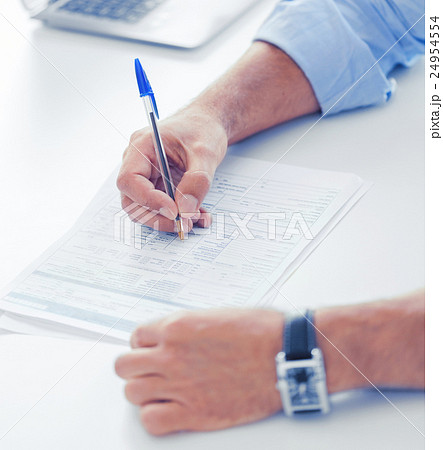 man filling tax form man filling tax form 24954554