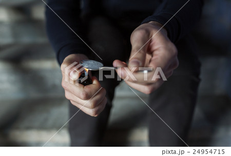 close up of addict preparing crack cocaine drug close up of addict preparing crack cocaine drug 24954715