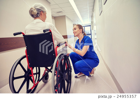 nurse with senior woman in wheelchair at hospital nurse with senior woman in wheelchair at hospital 24955357