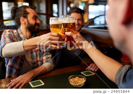 happy male friends drinking beer at bar or pub 24955844
