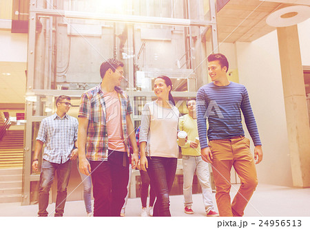 group of smiling students with paper coffee cups 24956513