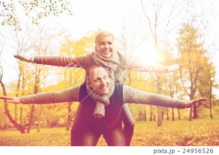 smiling couple having fun in autumn park smiling couple having fun in autumn park 24956526