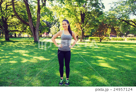 happy young woman exercising outdoors happy young woman exercising outdoors 24957124