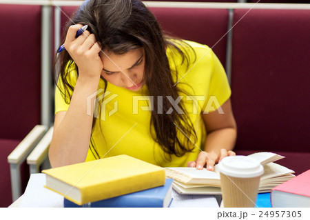 student girl with books and coffee on lecture student girl with books and coffee on lecture 24957305