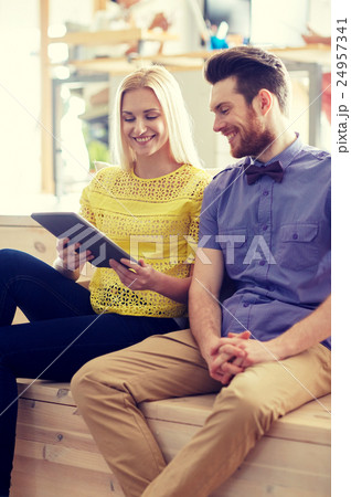 happy creative team with tablet pc in office happy creative team with tablet pc in office 24957341