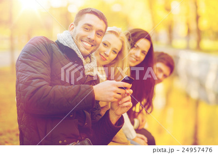 group of friends having fun in autumn park 24957476
