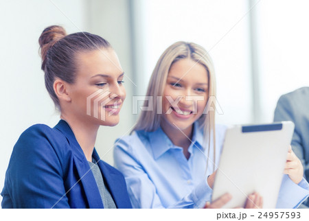 business team with tablet pc having discussion 24957593