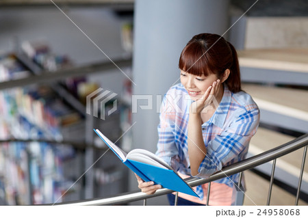 high school student girl reading book at library high school student girl reading book at library 24958068