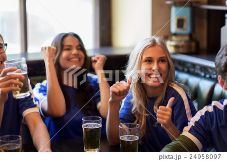 football fans or friends with beer at sport bar 24958097