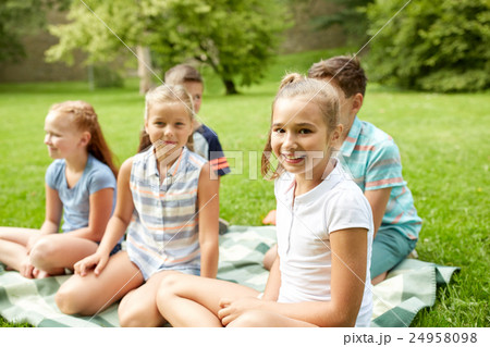group of happy kids or friends outdoors group of happy kids or friends outdoors 24958098