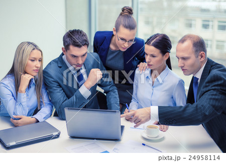 business team with laptop having discussion business team with laptop having discussion 24958114